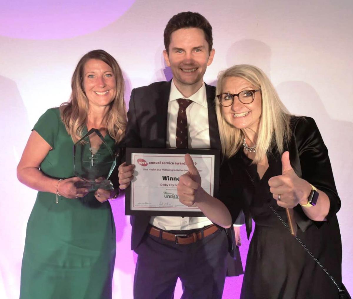 Livewell's Kellie, Rob and Dawn with the APSE award
